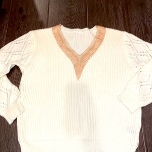 Cream sweater with accent neckline